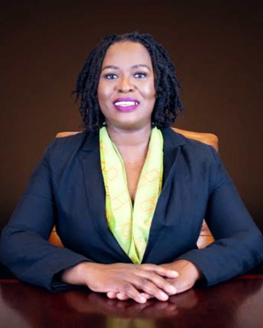 Nozibele Tshobeni, Founder and Managing Director of Tembeka Advisory, seated at a boardroom table.